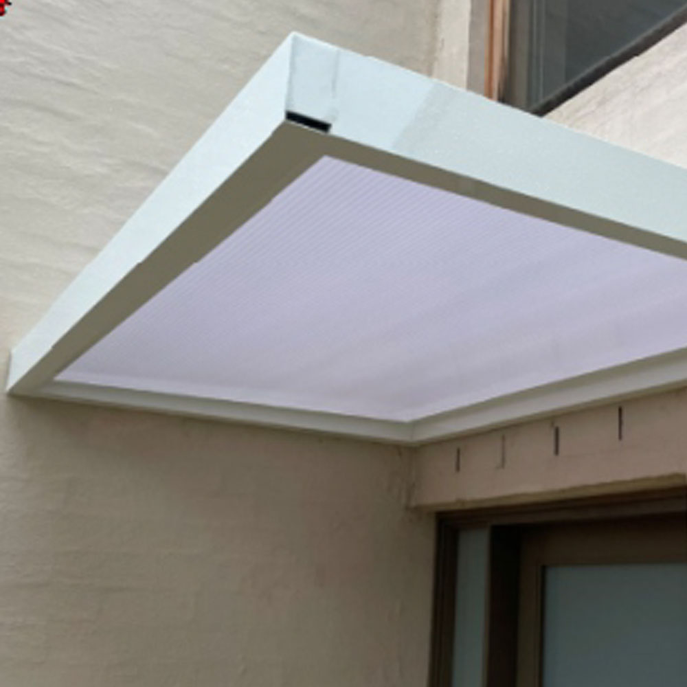 Slimline 100 aluminium awning with integrated internal gutter installed above a door