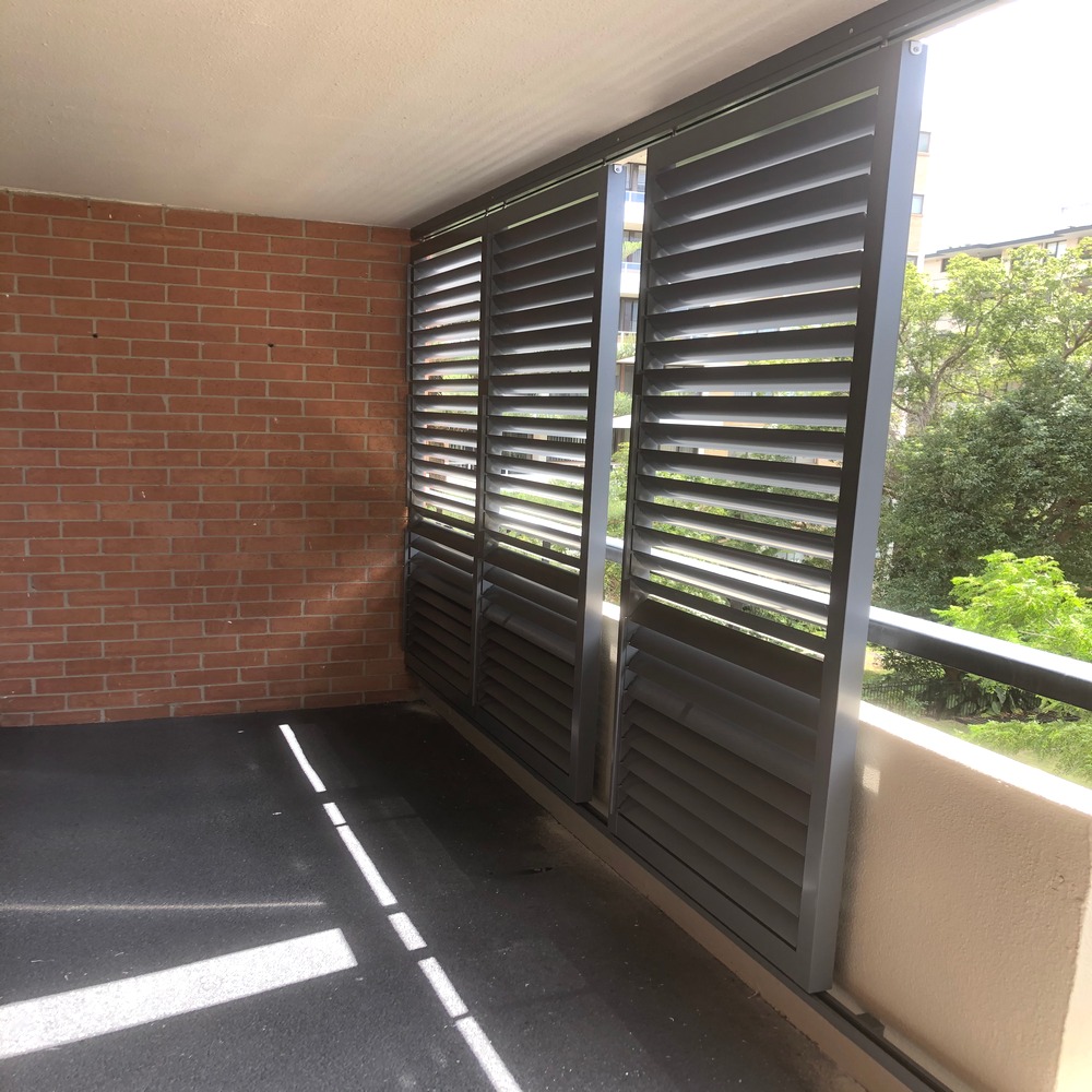 85mm sliding aluminium louvres installed on a balcony for privacy, airflow, and sun control