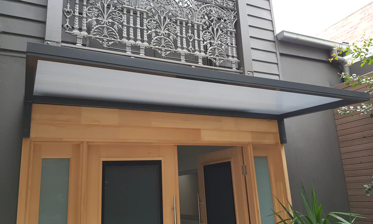 Aluminium window awning Sydney — Slimline 50 fixed arm awning over bifold doors